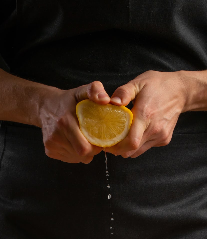 Chef squeezing lemon.