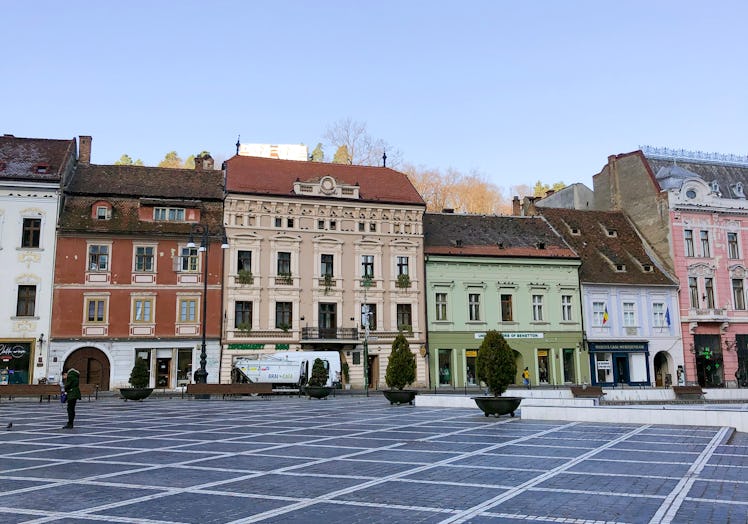 A landscape shot showcases colorful buildings in Brasov, Romania.