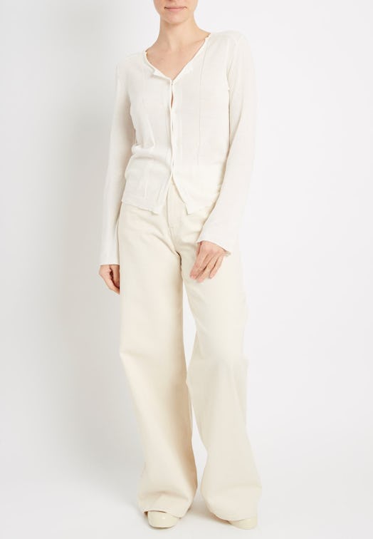 A white button-up cardigan from Inhabit with matching pants
