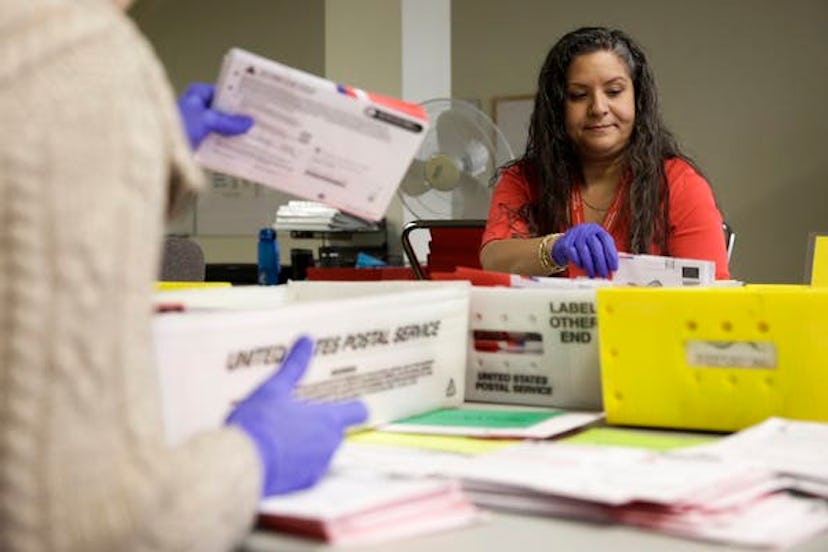 Election workers sort mailed-in ballots in Washington state on March 10.