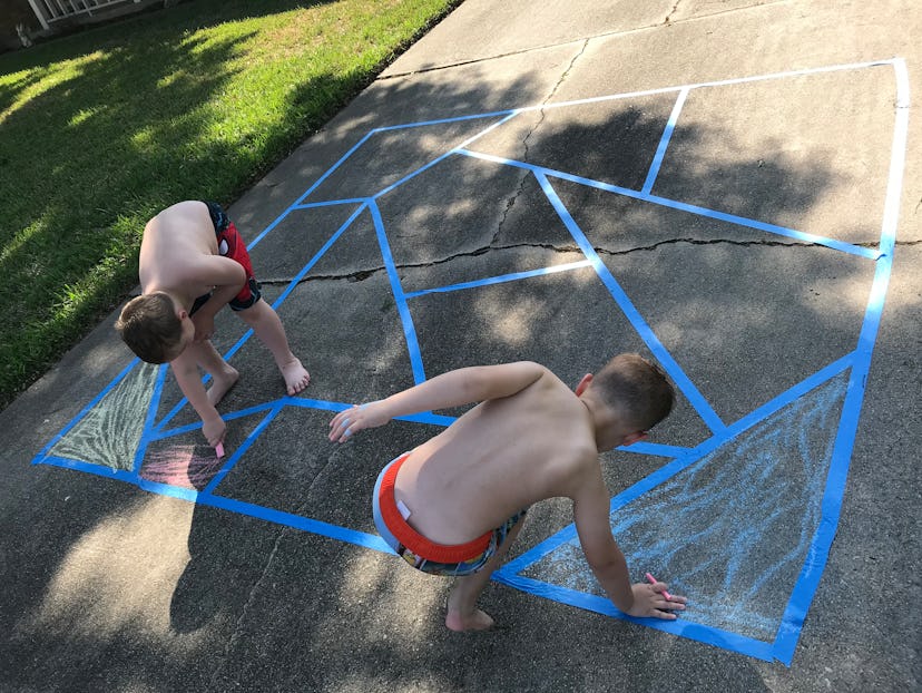 Creating a mosaic with painter's tape is one activity to do with sidewalk chalk. 