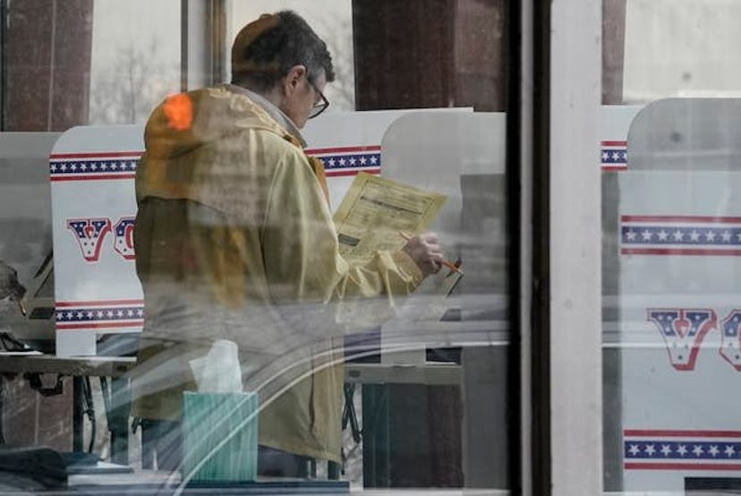 A Wisconsin voter casts a ballot ahead of primary election day, avoiding lines and finding a more co...