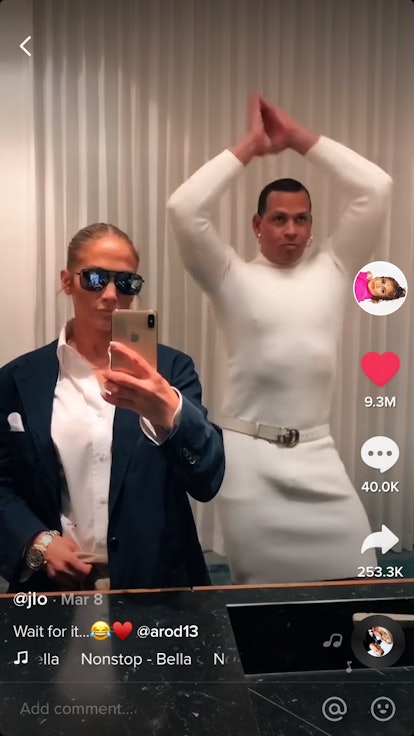 Jennifer Lopez and Alex Rodriguez stand in their bathroom, looking at the mirror, dressed in each ot...