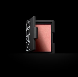 The NARS Orgasm Blush on a black background