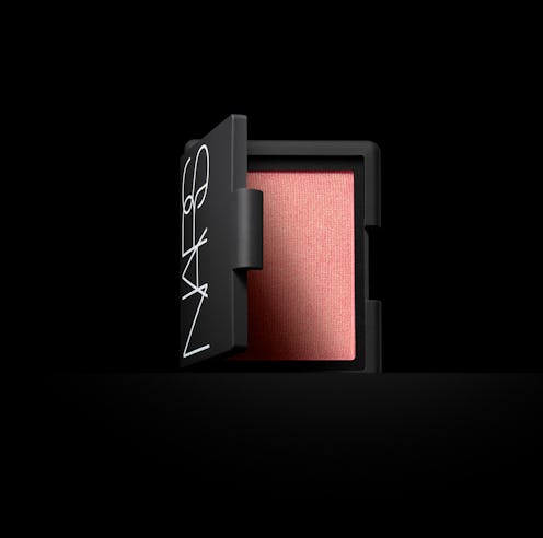 The NARS Orgasm Blush on a black background