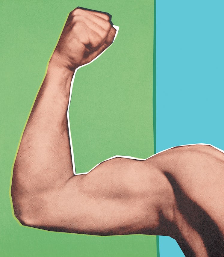 A man pointing his strong biceps muscle