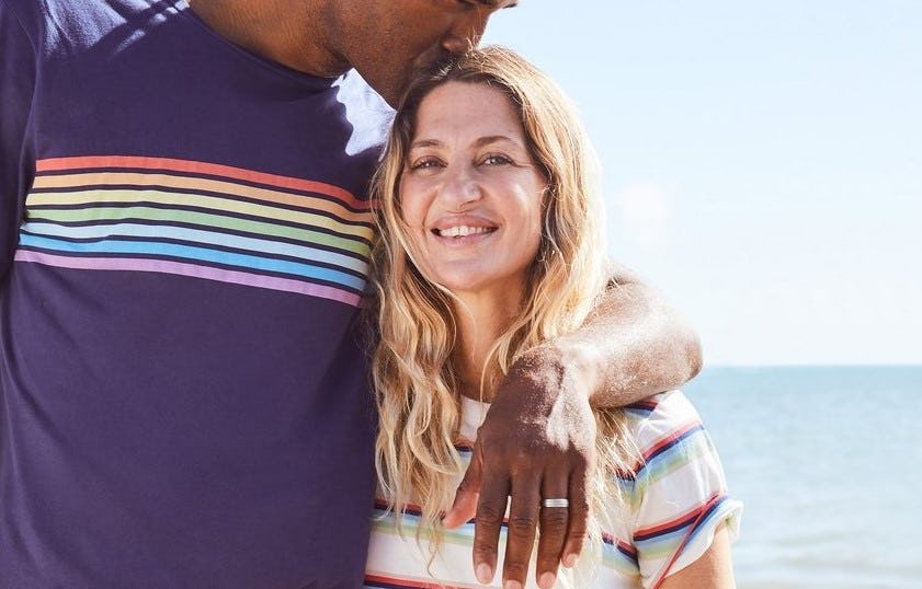 a man and a woman wearing primary t-shirts
