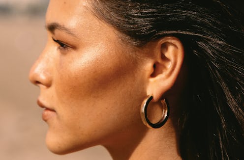 Tower 28's new Bronzino Illuminating Cream Bronzer swatched on model.