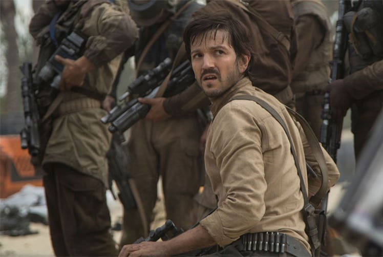Diego Luna as Andor holding a gun in the series 'The Mandalorian' next to a group of soldiers