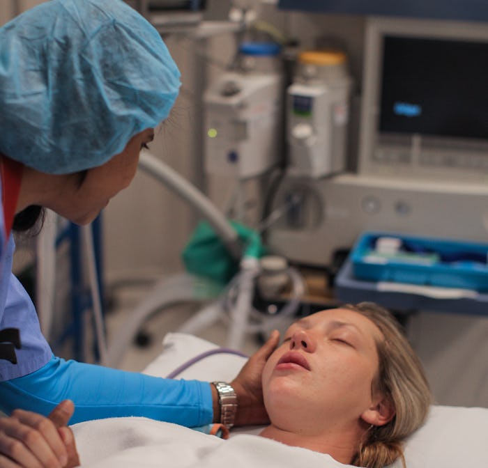 doula comforting woman