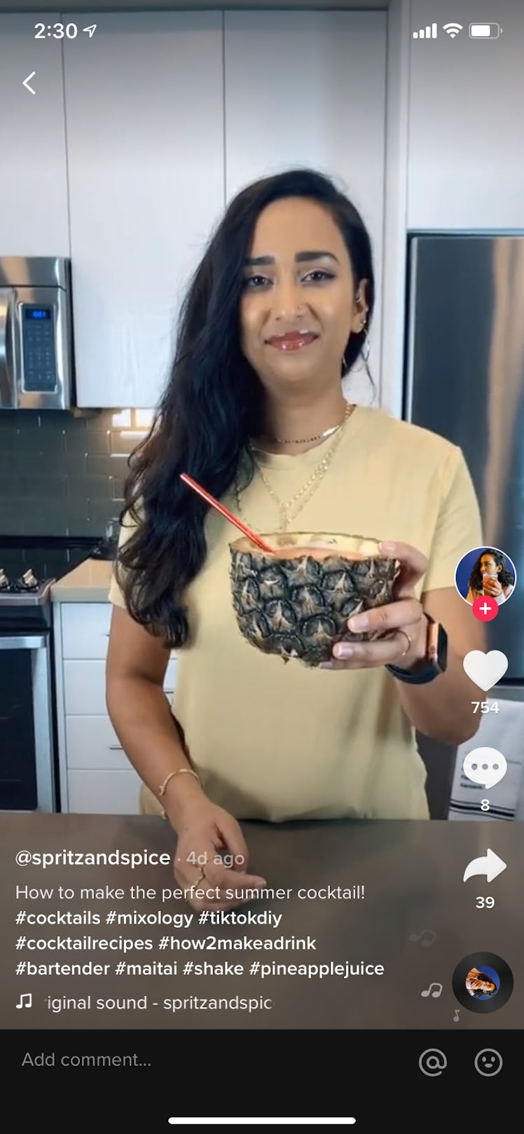 A young woman mixes up a pineapple mai tai in her kitchen on TikTok.