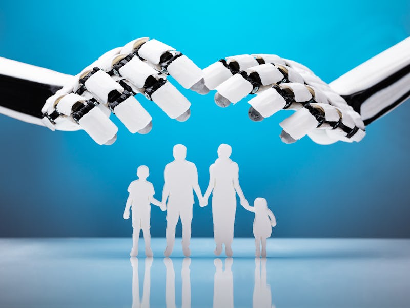 Robot hands over a silhouette of a family consisted of two parents, a son, and a daughter