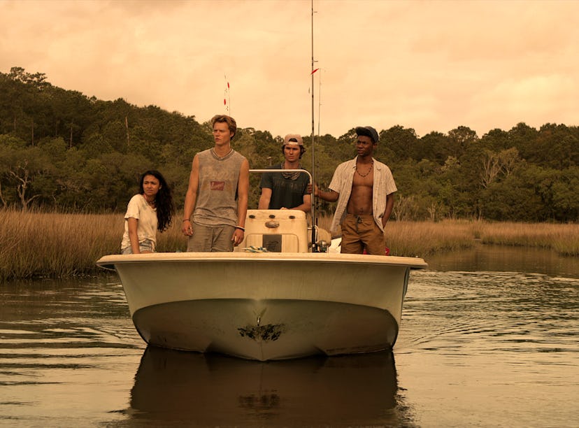 The cast of 'Outer Banks' on Netflix rides a boat