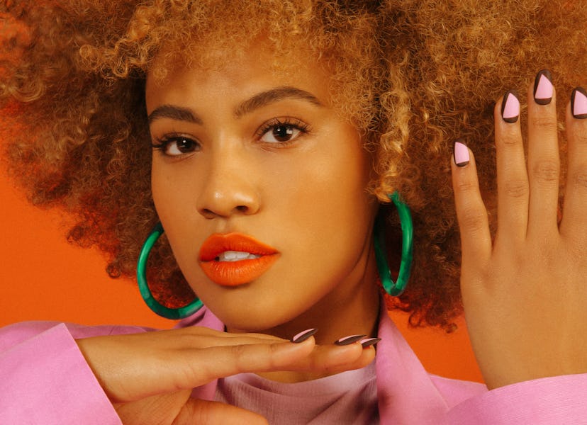 Female violinist Ezinma wearing a pink jacket featured in NYLON's February 2018 cover story