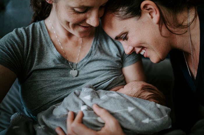 Parents greet their baby