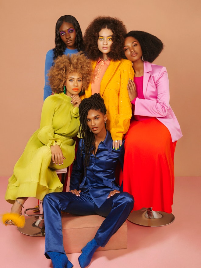 Five models dressed in navy blue, light blue, orange, pink and light green posing for NYLON's black ...