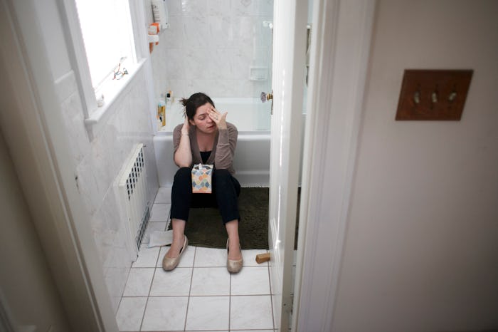 Woman experiences morning sickness in first trimester