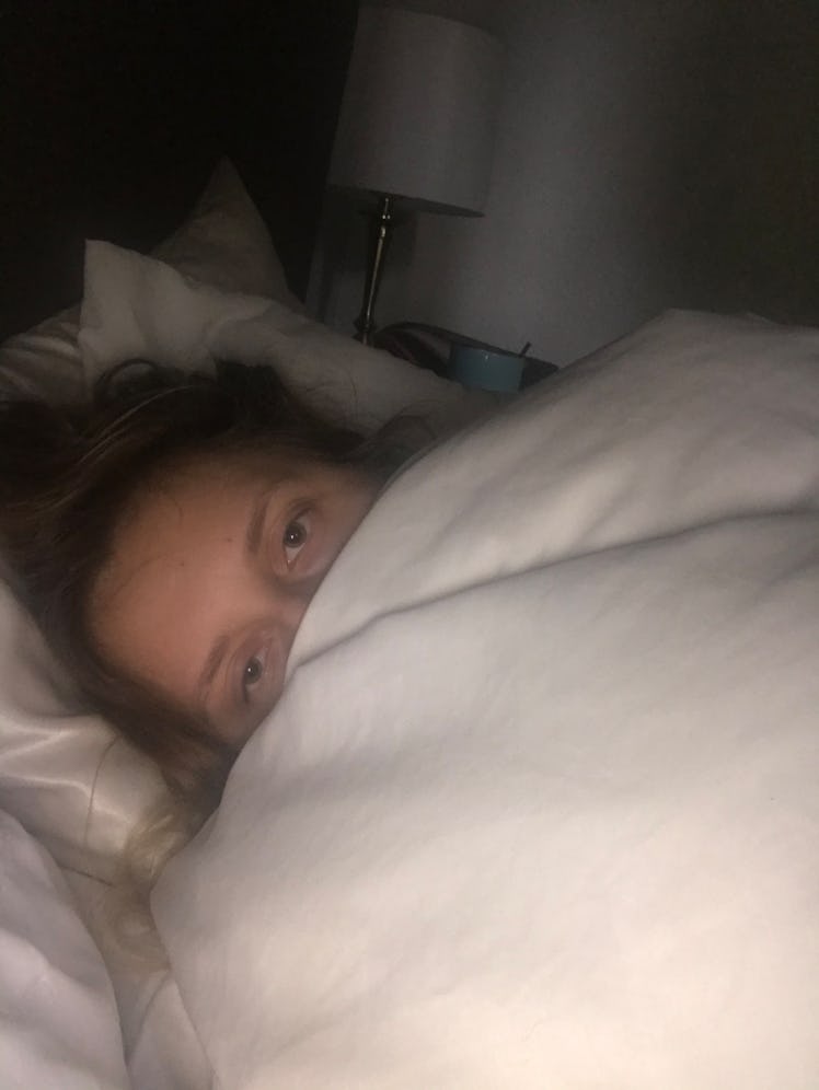 Rachel Varina lays in white duvet at 6 a.m.