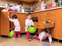 little girl playing in a kitchen, shown multiple times!