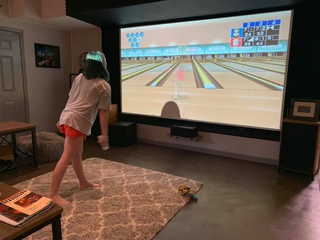 Kids can entertain themselves in quarantine by playing video games like Wii bowling. 