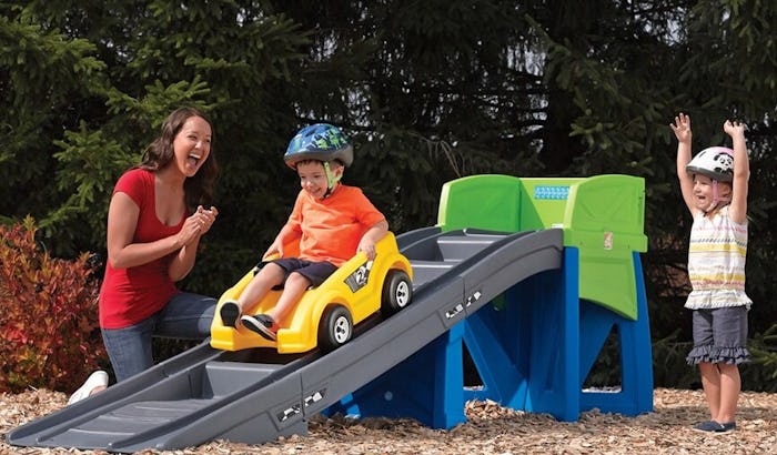 little boy going down a backyard roller coaster