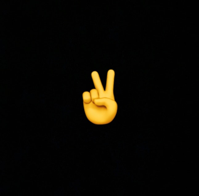 The two-finger emoji can represent the peace sign or "victory."