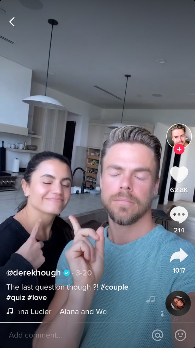 Derek Hough and his girlfriend stand in their kitchen, with their eye closed.  
