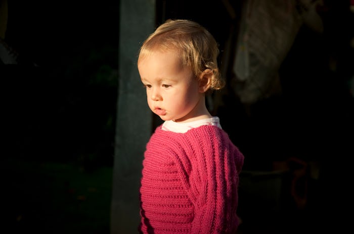 toddler looking out window
