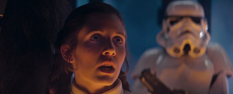 Leia having a shocked face while standing next to Stormtrooper