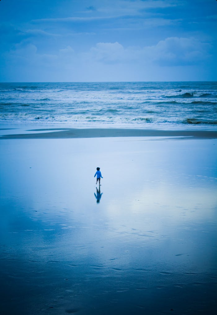 Toddler alone on a beach