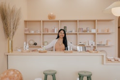 A woman inside The Things We Do, an L.A. beauty Bar with Filipina aesthetics