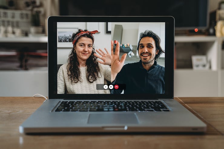 Laptop with a videoconference call on the screen. Living room. During Coronavirus Covid-19 quarantin...