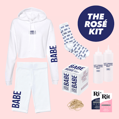 The Rosé Kit from BABE Wine includes a white sweatshirt and biker shorts, bottles of rosé, and tie-d...