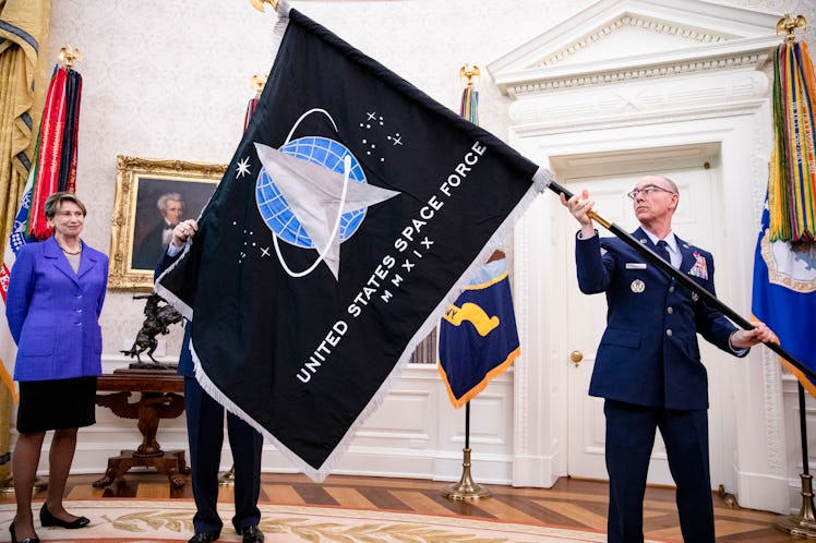 The official flag of the United States Space Force in the Oval Office of the White House in Washingt...