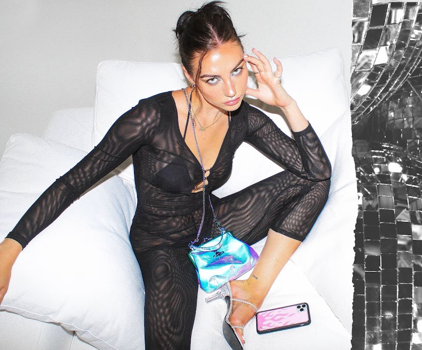 Sydney Carlson, co-founder & designer of "Wildflower Cases" in her night out black body suit and a s...