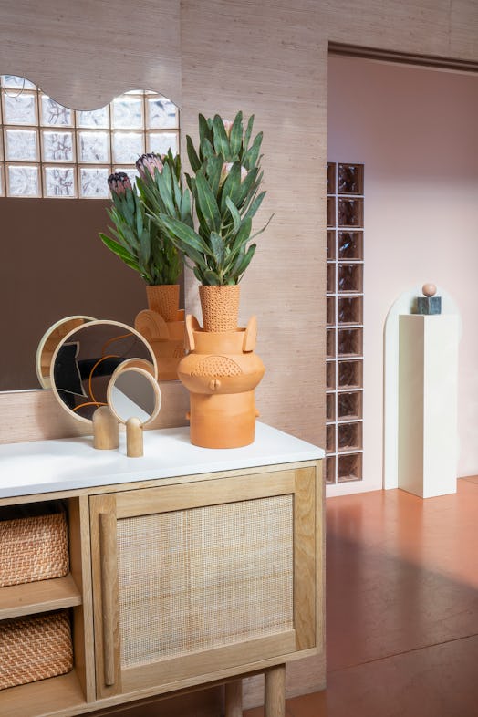A cozy counter part with a plant at 'The Things We Do', an L.A. beauty bar with Filipina aesthetics