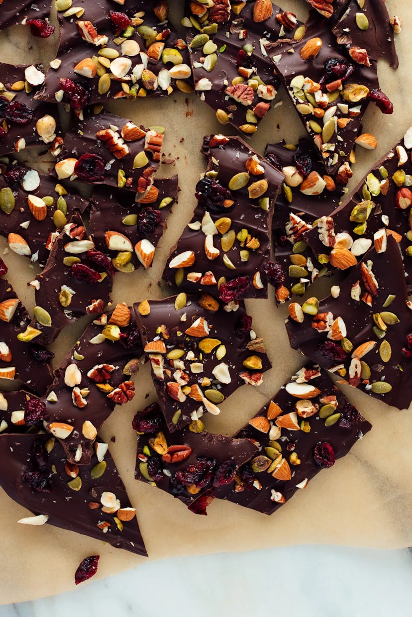 Dark brown chocolate slabs dotted with nuts and raisins.