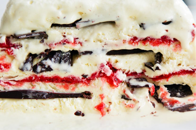 layers of dark chocolate and strawberries with vanilla semifreddo layering between.