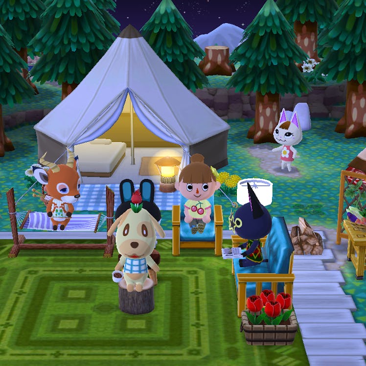 A group of villagers hangs out at a campsite at night in 'Animal Crossing: Pocket Camp.'