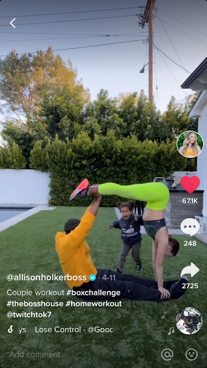 A couple workouts out together in the backyard, creating a box shape with their bodies. 