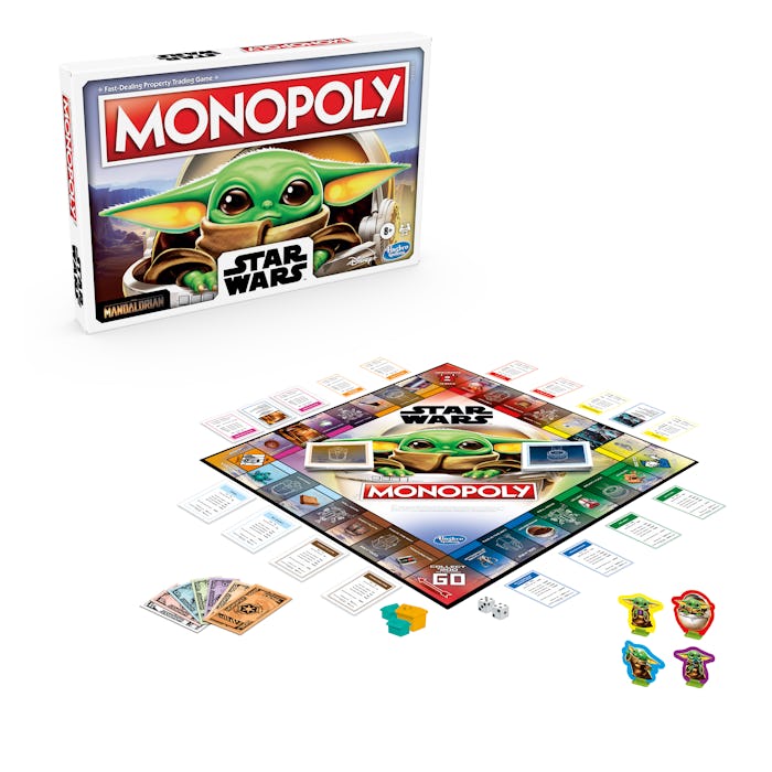 An image of a Monopoly board with the figure of The Child from The Mandalorian on the surface. 