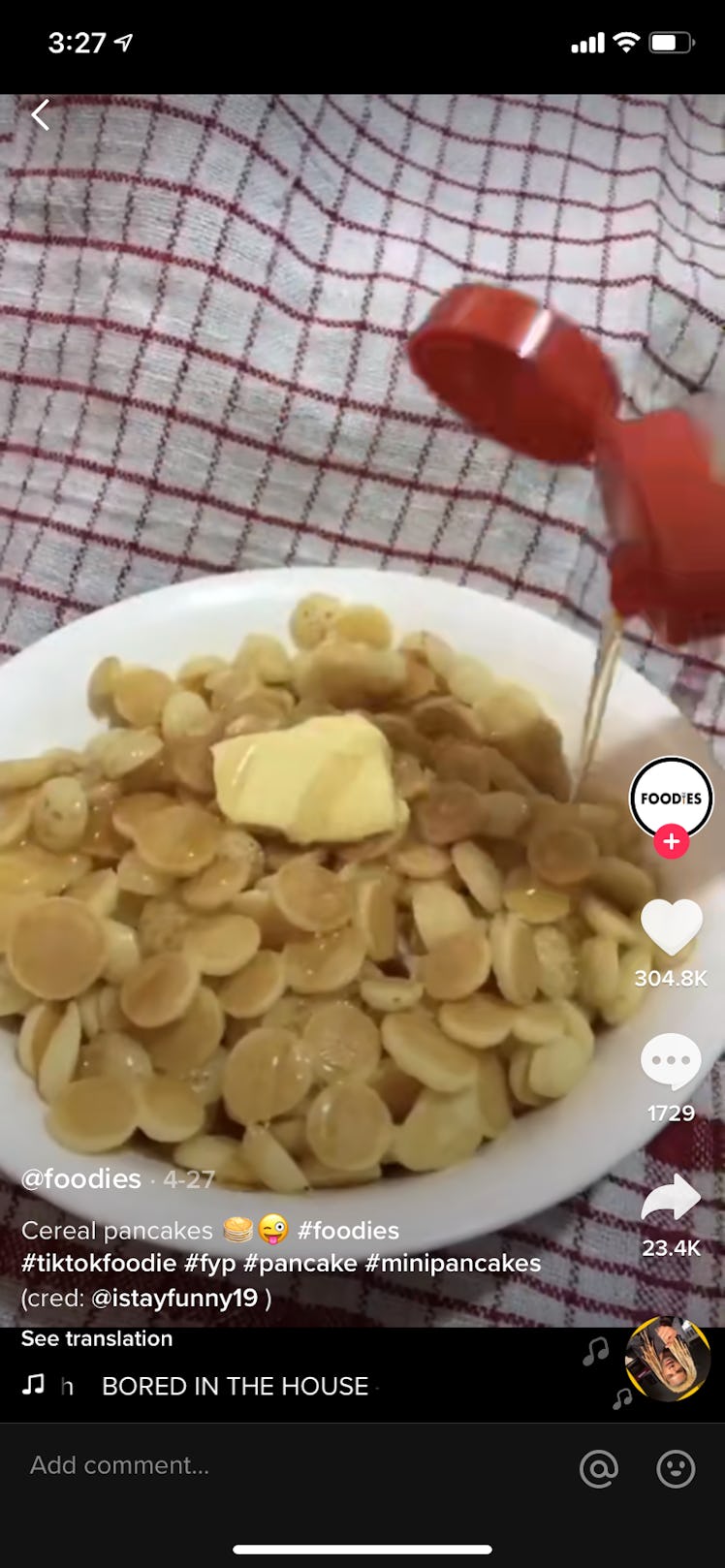 A person pours syrup over a bowl of pancake cereal on TikTok.