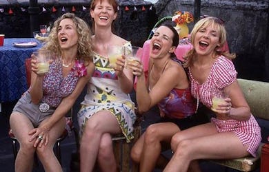Carrie, Samantha, Charlotte, and Miranda from "Sex and the City"  having a drink together