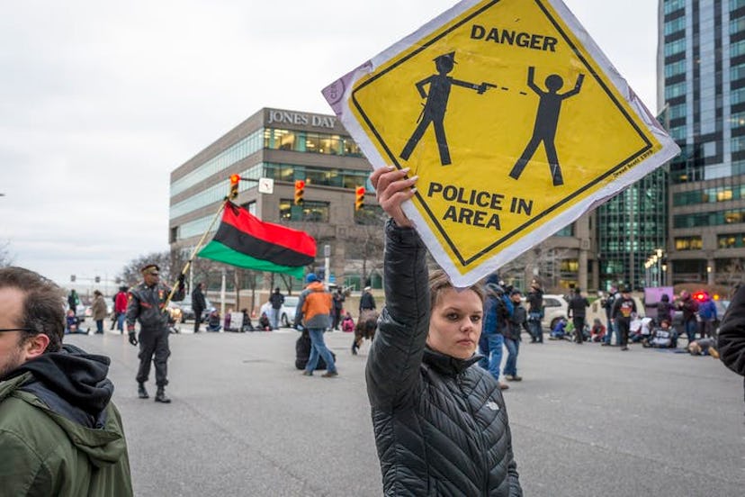 Protesters took to the street the day after a grand jury declined to indict Cleveland Police Officer...