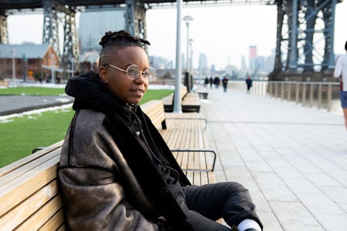 1.Emma McGowan, certified sex educator and writer sitting on a wooden bench.