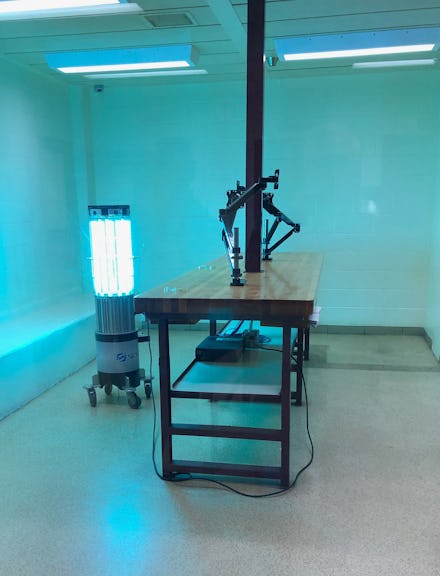 A robot emits high-intensity ultraviolet light in a booking room at the Kent County Jail in Grand Ra...