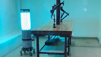 A robot emits high-intensity ultraviolet light in a booking room at the Kent County Jail in Grand Ra...