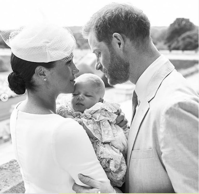 Prince Harry is devoted to baby Archie at his christening.