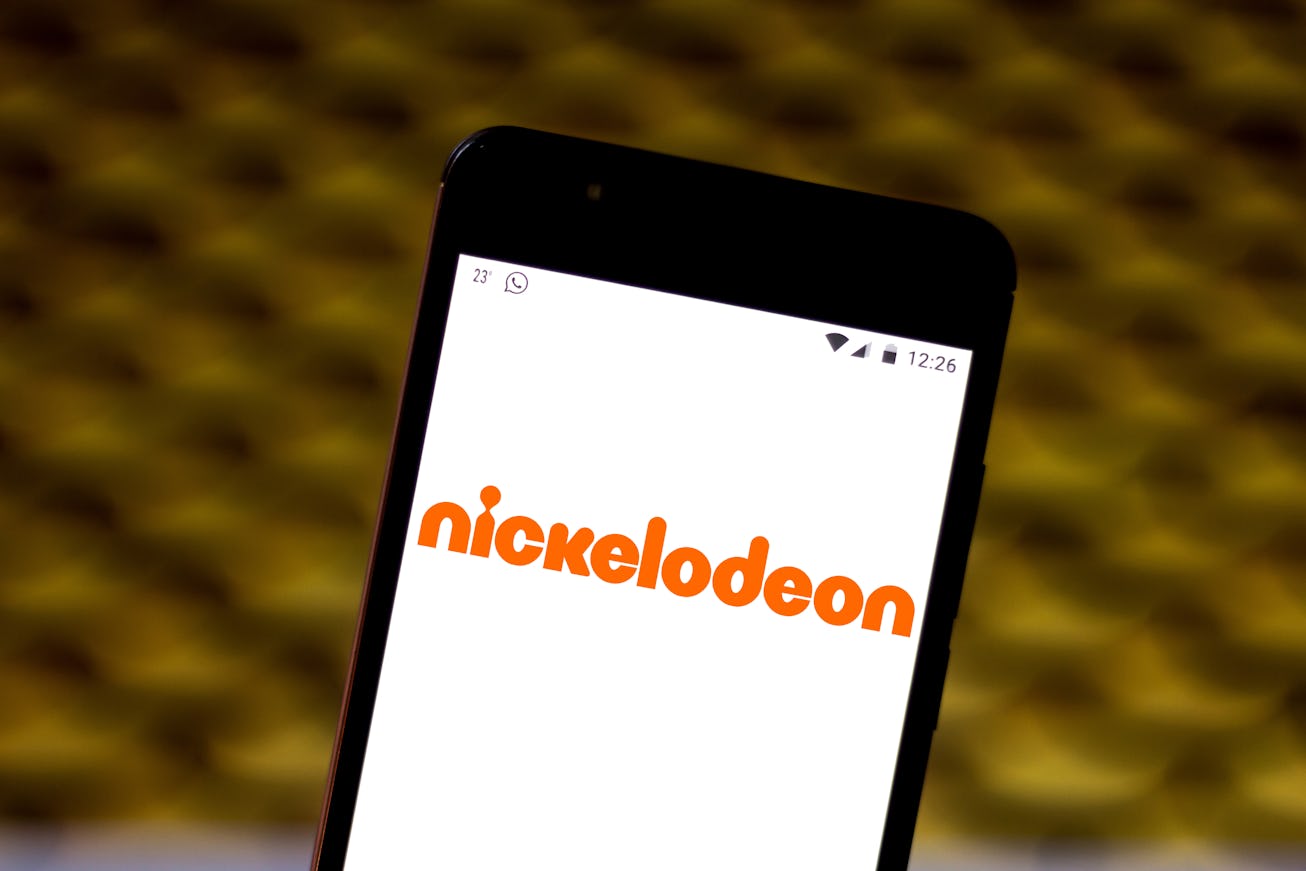 In this photo illustration the Nickelodeon logo is seen displayed on a smartphone.