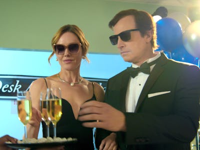 Rob Huebel and Erinn Hayes wearing sunglasses and black-tie attire in the "Medical Police" series 